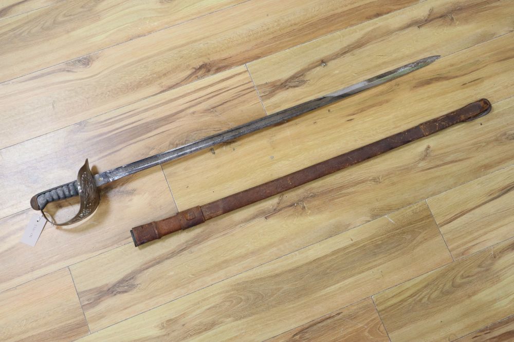 An Edward VII Infantry Officers sword, shagreen grip and 91cm etched, single edged blade, leather scabbard